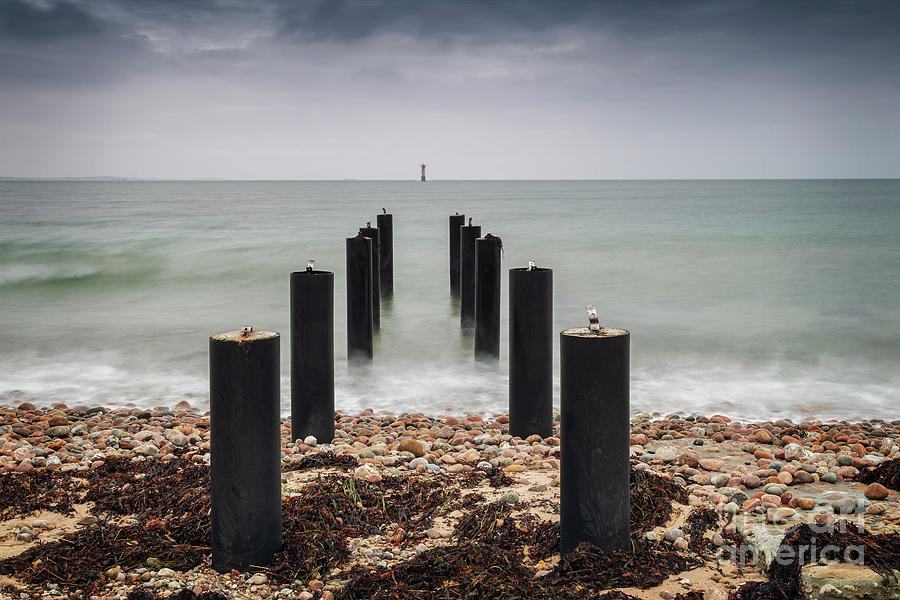 Ocean pier posts Sweden Photograph by Sophie McAulay