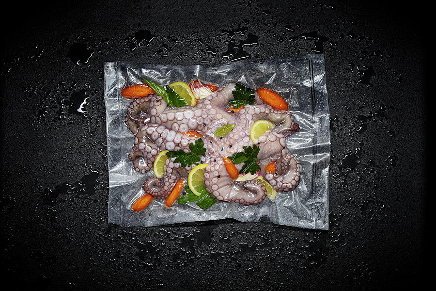 Octopus With Lemons And Herbs In A Sous Vide Bag Photograph by Maximilian Carlo Schmidt