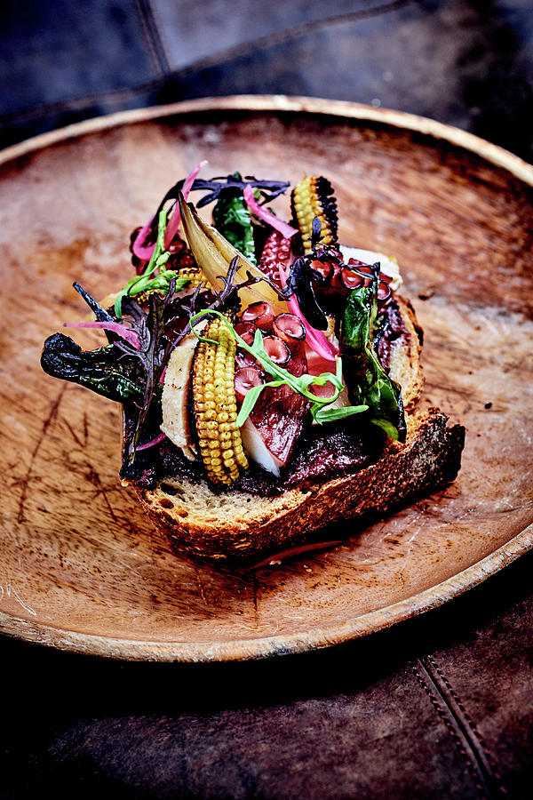 Octopus,chicken,mini Corn On The Cobs,sprouts And Kalamata Black Olives On Toasts Photograph by Amiel