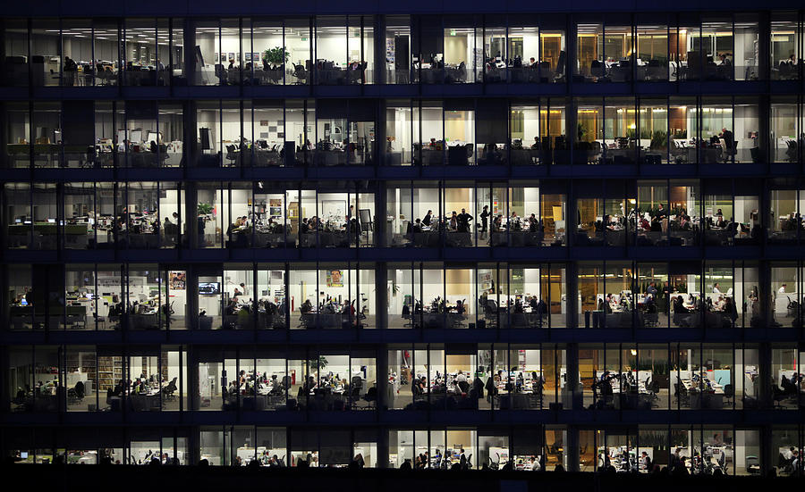 Office Workers Labour Into The Night Photograph by Oli Scarff