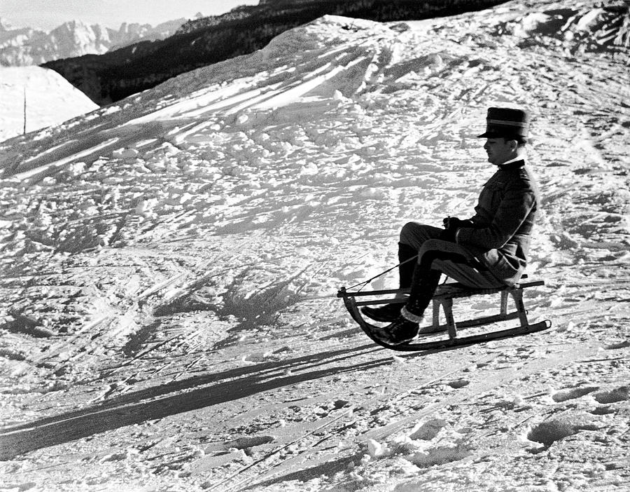 Black And White Photograph - Officer Sledding by Alfred Eisenstaedt
