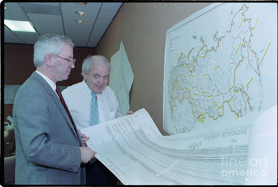 Officials Reviewing Geological Charts Photograph by Bettmann