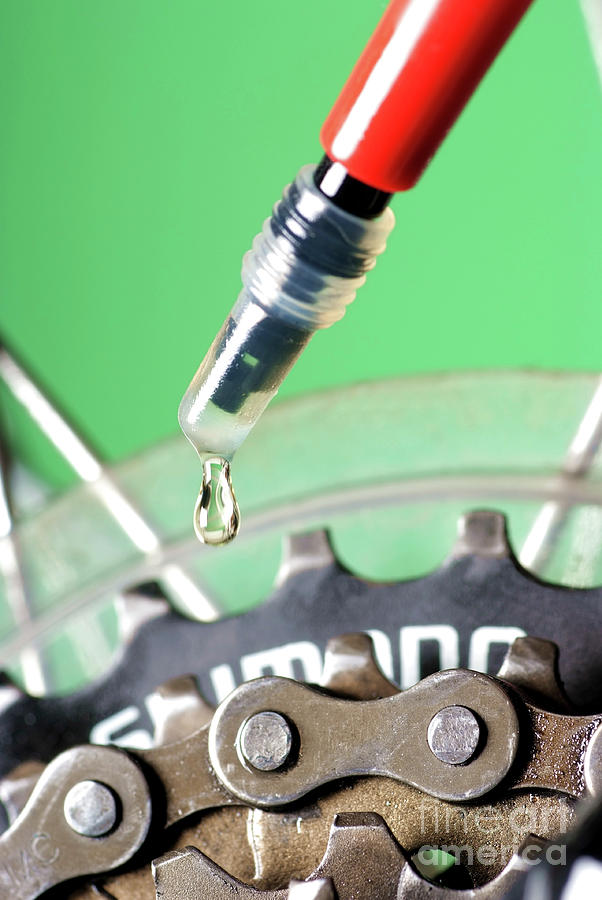 Oiling A Bicycle Chain Photograph by Martyn F. Chillmaid/science Photo Library