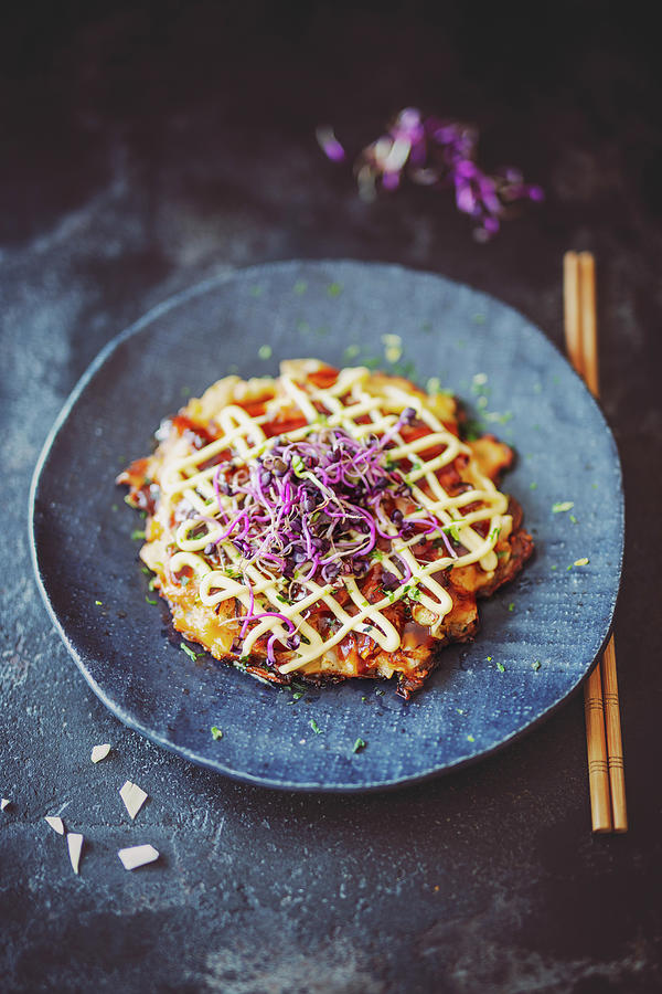 Okonomiyaki pancake With Cabbage, Red Ginger And Bonito Flakes, Japan Photograph by Jan Wischnewski