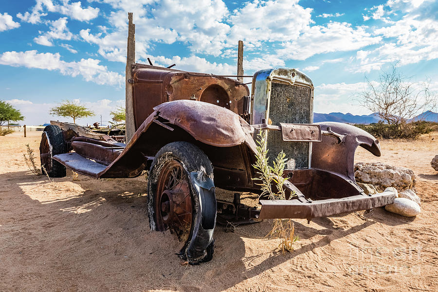 Old and abandoned car #3 in Solitaire, Namibia Photograph by Lyl Dil Creations