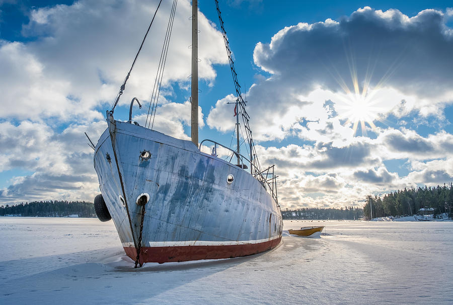 Winter Photograph - Old And Broken Abandoned Ship On Ice by Jani Riekkinen