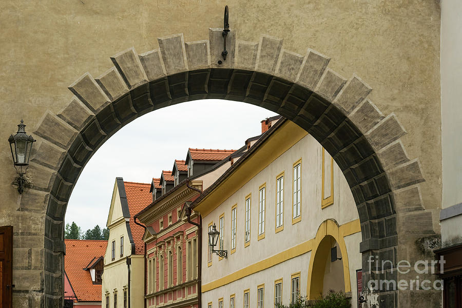 Old archway with a view of pretty buildings Photograph by Les Palenik