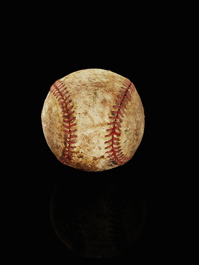 Old Baseball On Back Background Photograph by Alexander Nicholson