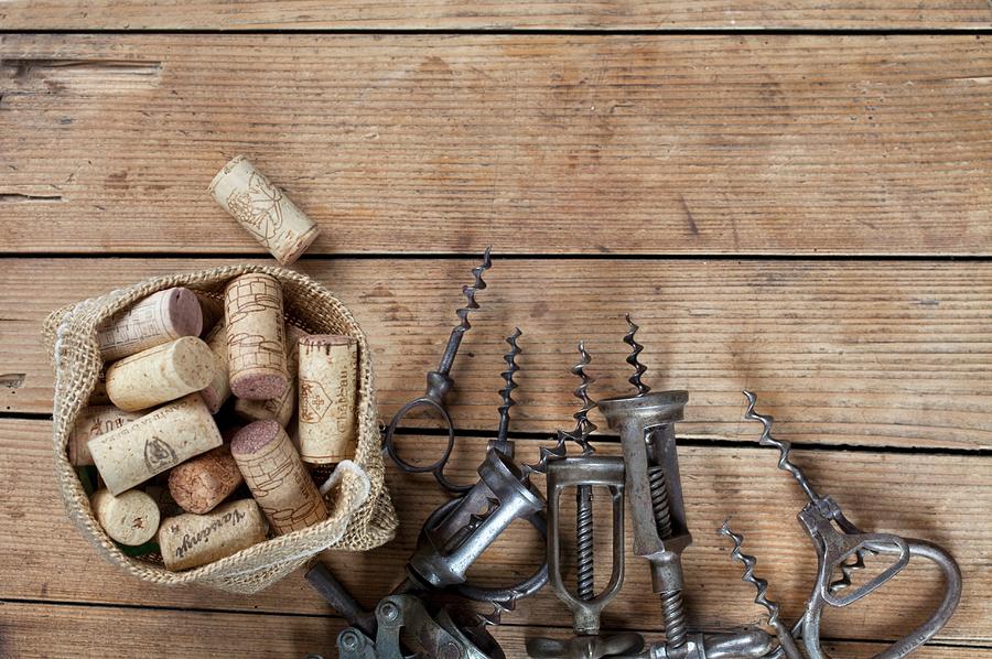 Old Corkscrews And Corks Photograph by Pawel Worytko