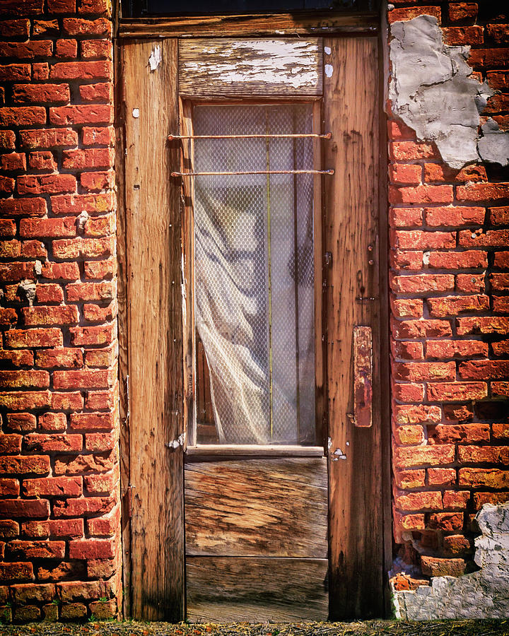 Old Door On An Old Store Photograph by James Eddy