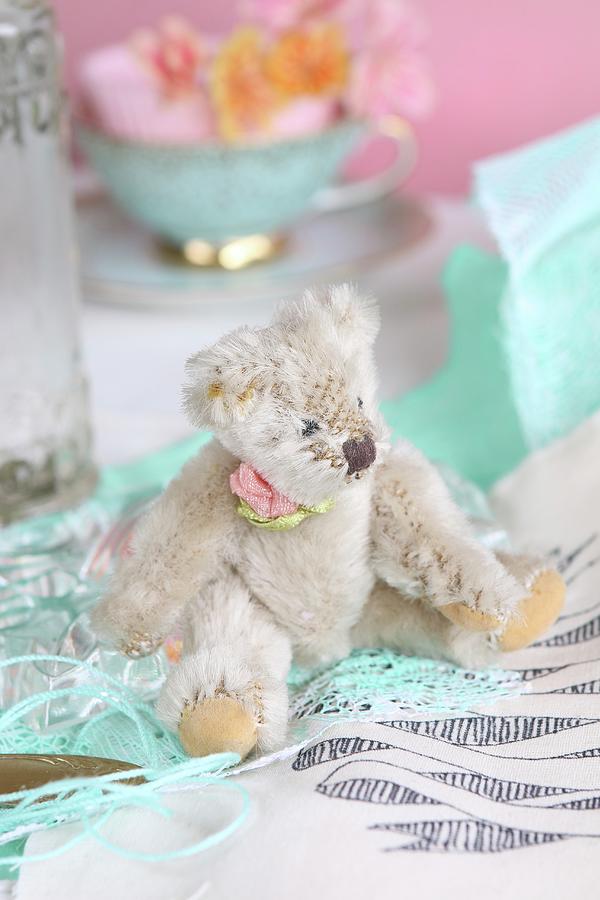 Old-fashioned Teddy Bear Sitting On Fabric Photograph by Regina Hippel