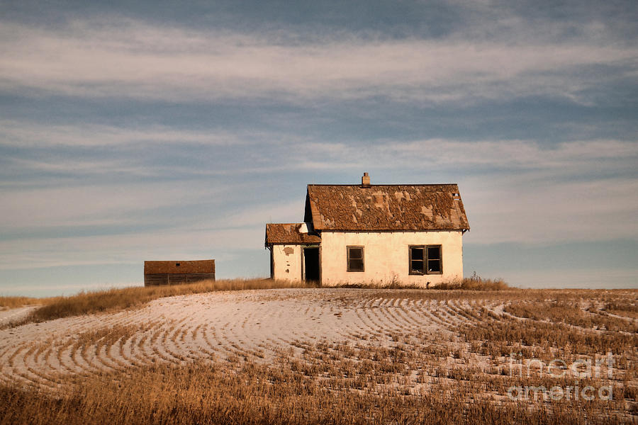 Old home in a coald field Photograph by Jeff Swan