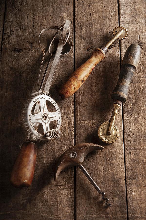 Old Kitchen Utensils On A Wooden Surface Photograph by Piga & Catalano S.n.c.