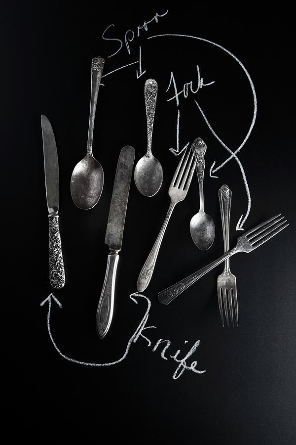 Old Knives, Spoons And Forks On A Slate Surface With Labels Photograph by Vfoodphotography