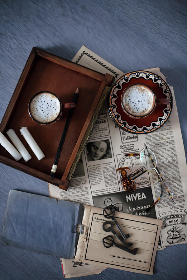 Old Newspaper, Tray, Coffee Cups, Candles And Key Photograph by Alicja Koll