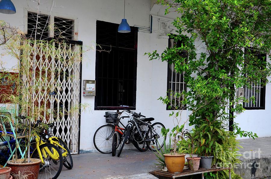 Old shop house with bicycles and windows on pavement Kampong Glam Singapore Photograph by Imran Ahmed