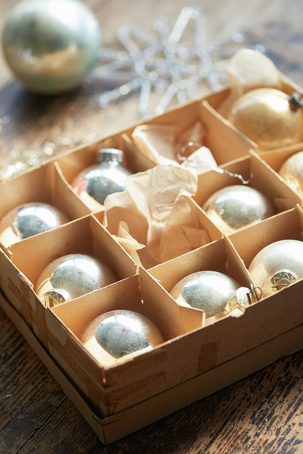 Old Silver Christmas Baubles In Cardboard Box Photograph by Inge Ofenstein
