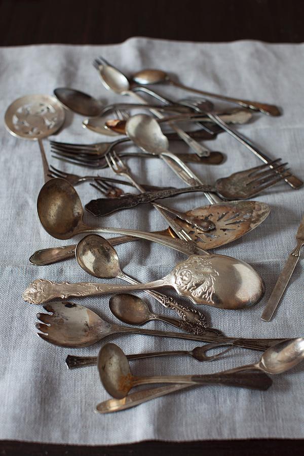 Old Spoons And Forks On Linen Photograph by Strokin, Yelena