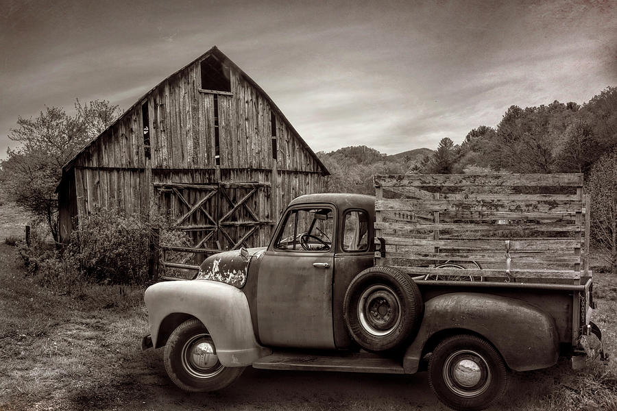 Old Truck at the Barn in Vintage Sepia Photograph by Debra and Dave Vanderlaan