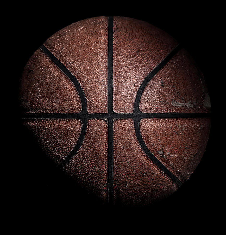Old Used Basketball On Black Photograph by Justin Lambert