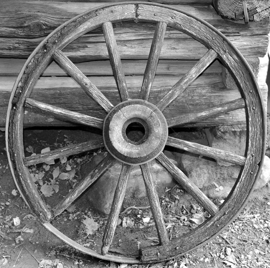 Old wagon wheel work A by David Lee Thompson.