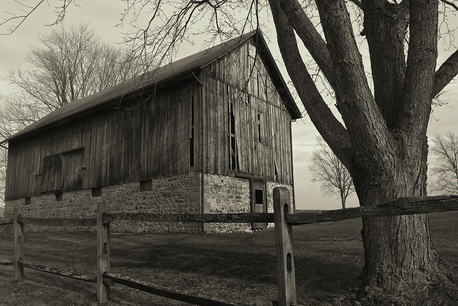 Black And White Photograph - Old Weathered Barn And Wooden Fence B&w by Anthony Paladino
