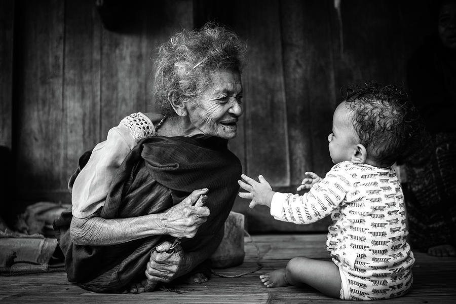 Old woman playing to child Photograph by Chantelle Flores - Fine Art ...