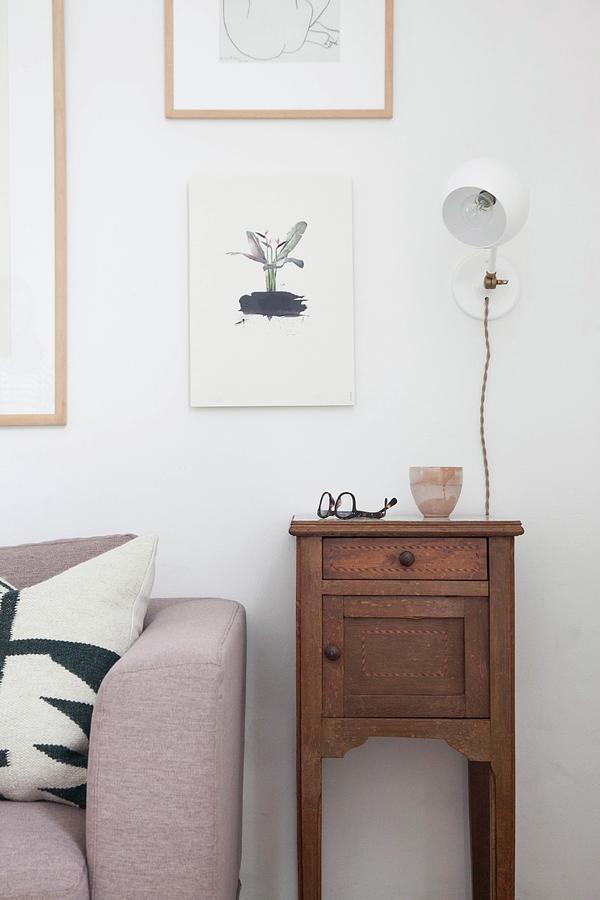 Old Wooden Cabinet Next To Sofa Photograph by Holly Marder