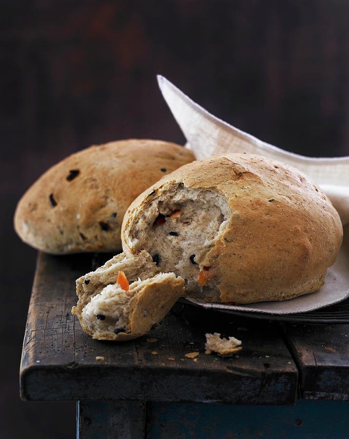 Olive And Carrot Bread Photograph by Mikkel Adsbl