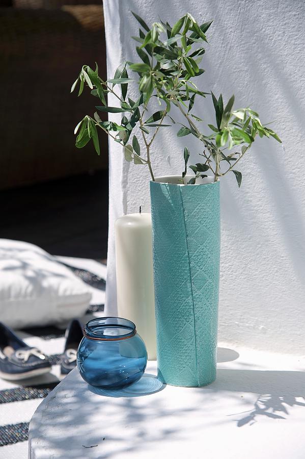 Olive Branch In Turquoise Vase, Glass Tealight Holders And Large Pillar Candle Photograph by Winfried Heinze