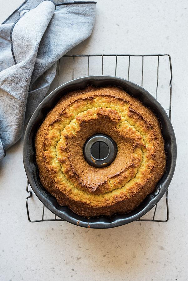 Olive Oil Bundt Cake In A Baking Tin Photograph by Hein Van Tonder