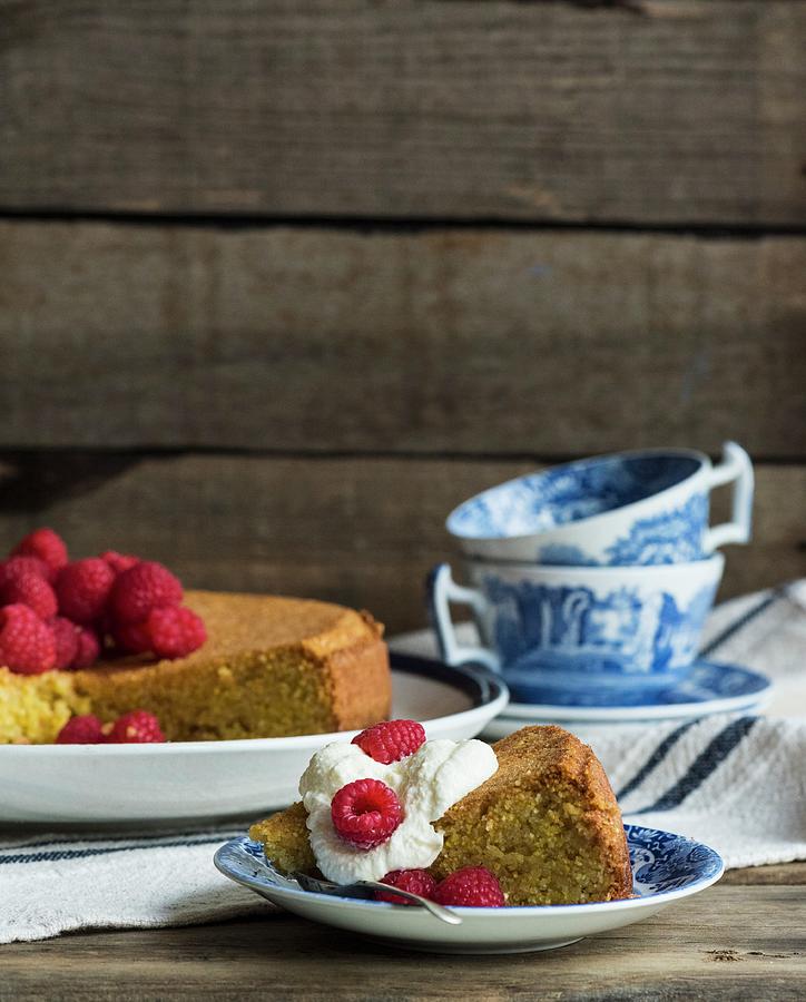 Olive Oil Cake With Raspberries And Cream, Sliced Photograph by Hein Van Tonder