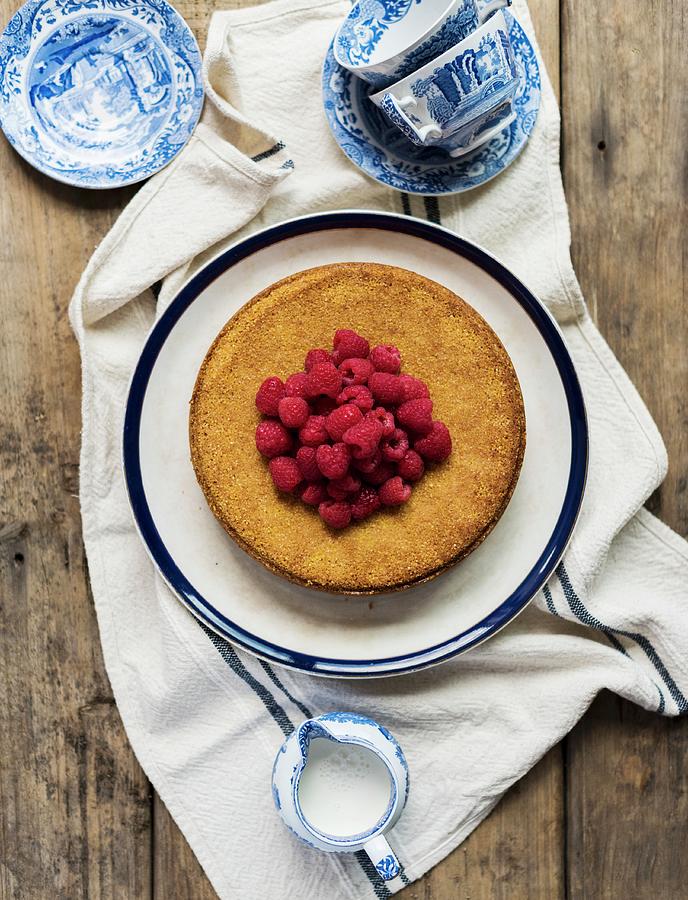 Olive Oil Cake With Raspberries seen From Above Photograph by Hein Van Tonder