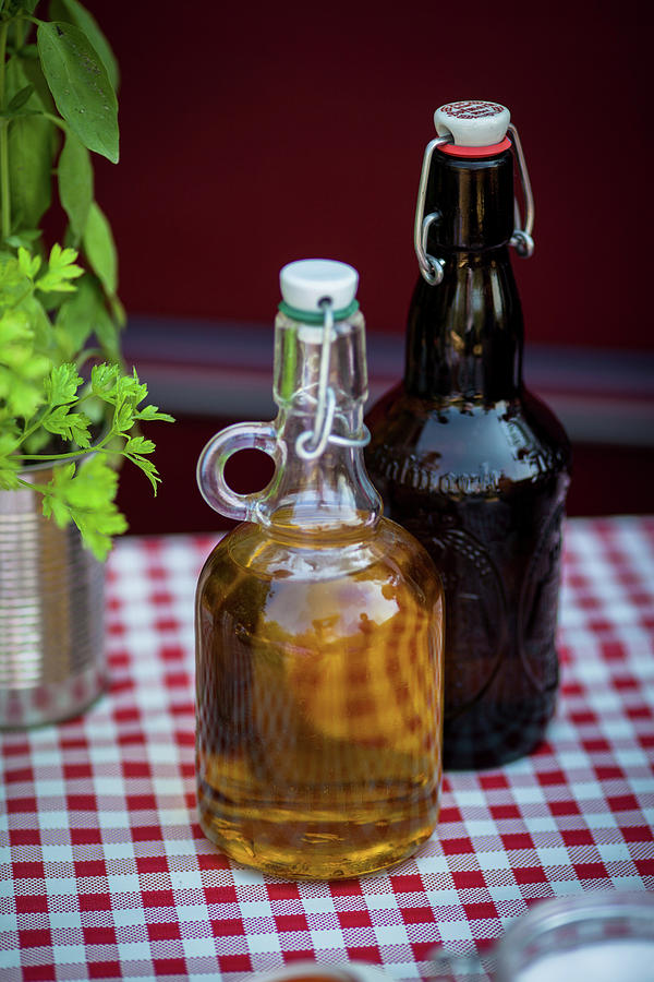 Olive Oil In Bottle Photograph by Eising Studio