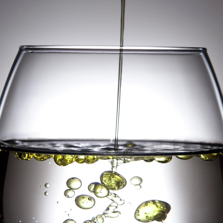 Olive Oil In Water Reveals Photograph by Greg Samborski