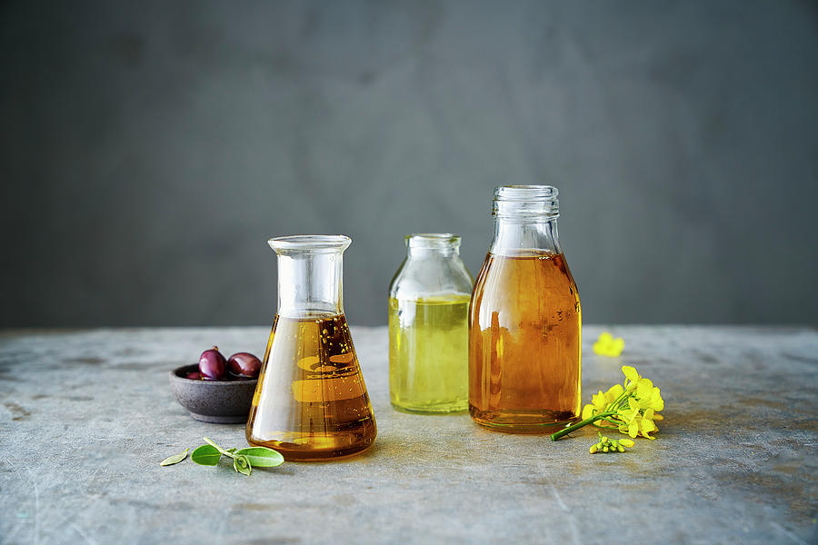 Olive Oil, Rapeseed Oil And Sunflower Oil Photograph by Lina Eriksson