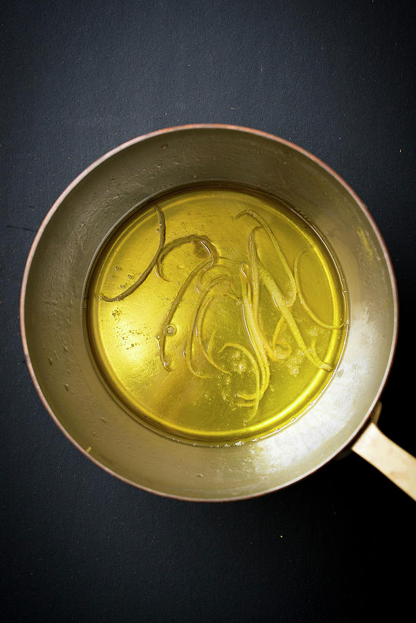 Olive Oil With Lemon Zest In A Pan Photograph by Manuela Rther
