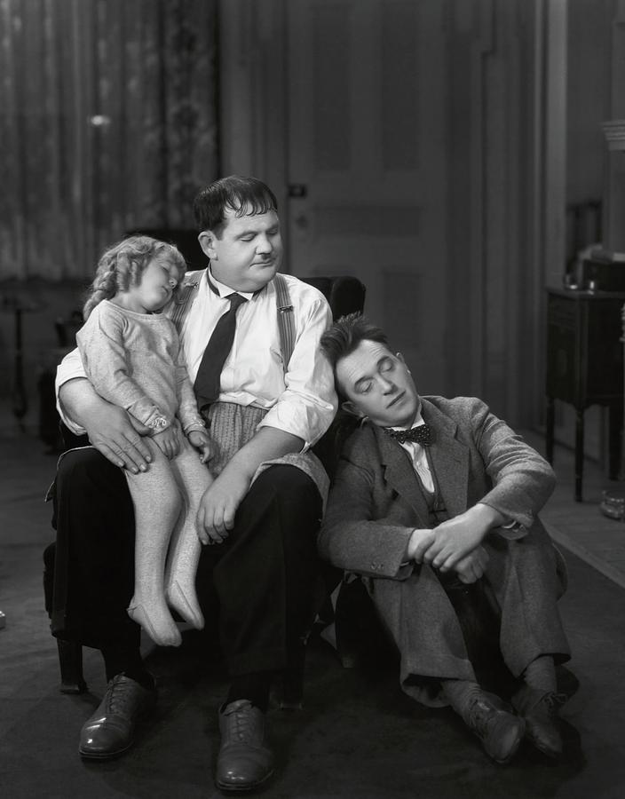 OLIVER HARDY , STAN LAUREL and JACQUIE LYN in PACK UP YOUR TROUBLES -1932-. Photograph by Album