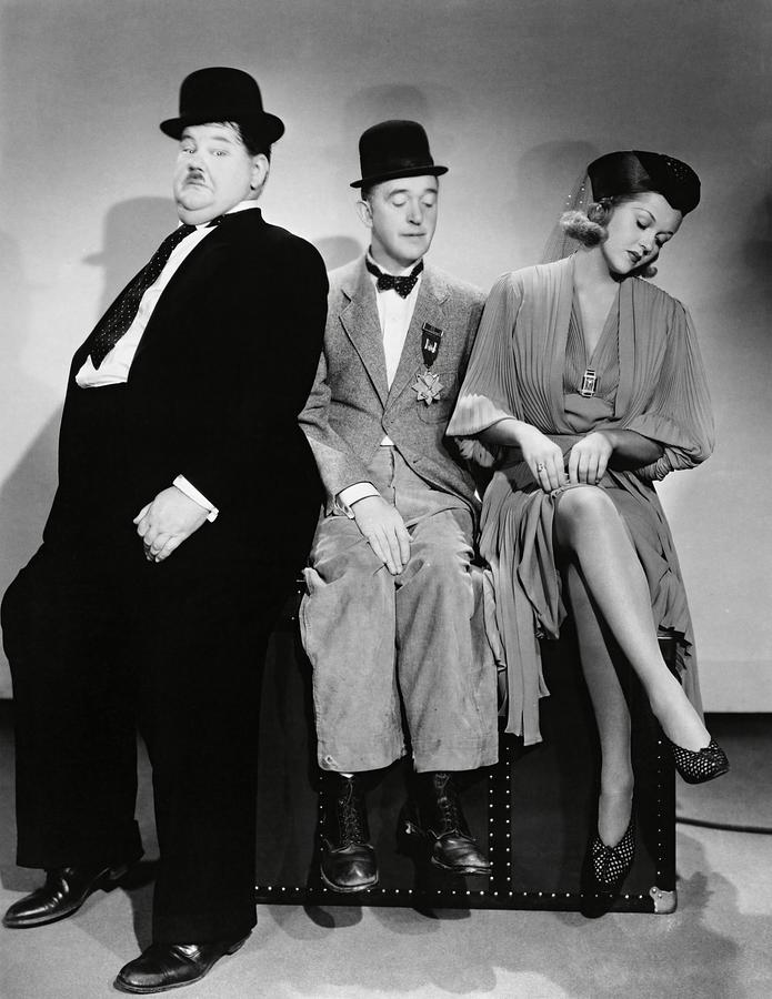OLIVER HARDY , STAN LAUREL and PATRICIA ELLIS in BLOCK-HEADS -1938-. Photograph by Album