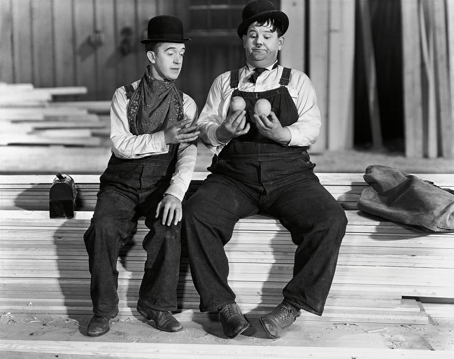 OLIVER HARDY and STAN LAUREL in BUSY BODIES -1933-. Photograph by Album