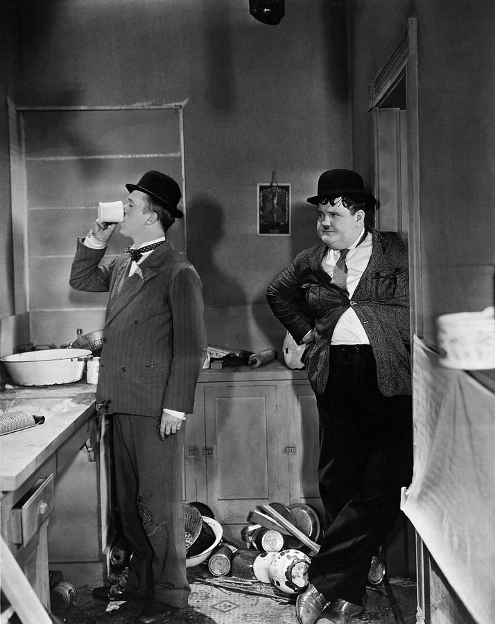 OLIVER HARDY and STAN LAUREL in ONE GOOD TURN -1931-. Photograph by Album