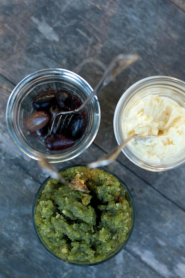 Olives And Two Dips In Jars Photograph by Magdalena Bjrnsdotter