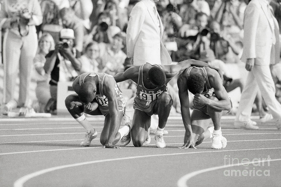 Olympic Medal Winners Pray In Thanks Photograph by Bettmann