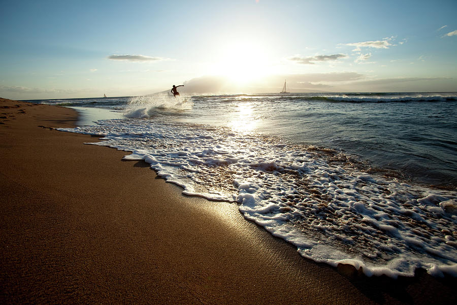 One Man Skimboarding At Sunset With Photograph by Trevor Clark