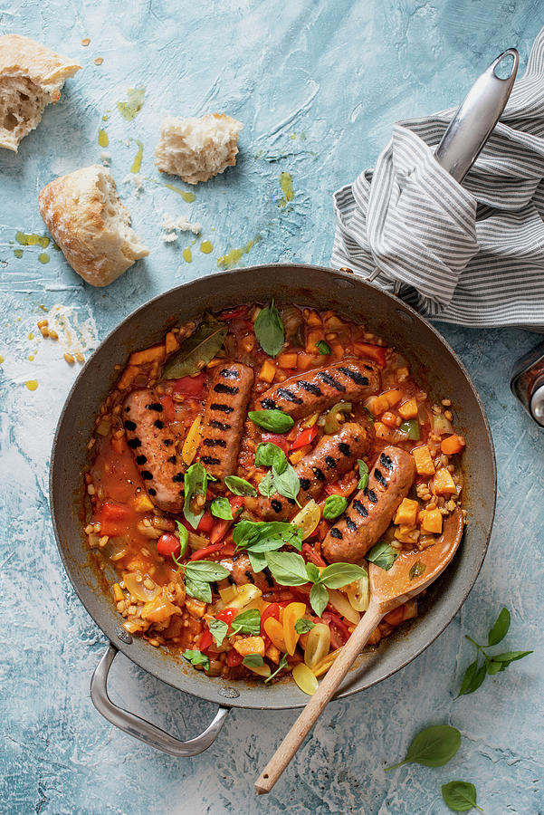 One Pot Chorizo Style Sausages With Pearl Barley, Sweet Potatoes, Tomatoes And Basil Photograph by Magdalena Hendey