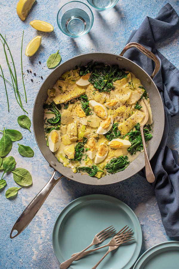 One Pot Dish, Smoked Haddock, Sliced Potato, Leek, Egg And Spinach Stew Photograph by Magdalena Hendey