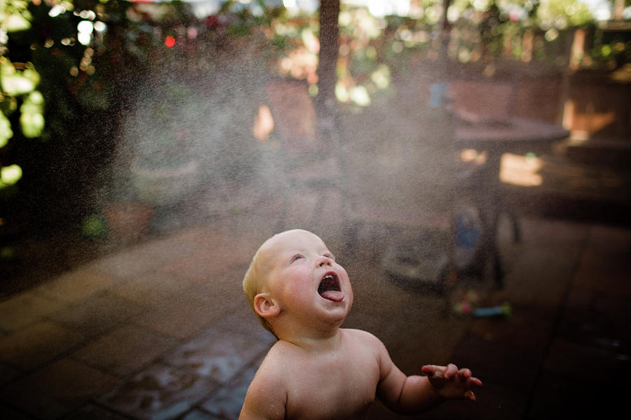 San Diego Photograph - One Year Old Boy Catching Water With Tongue In San Diego by Cavan Images