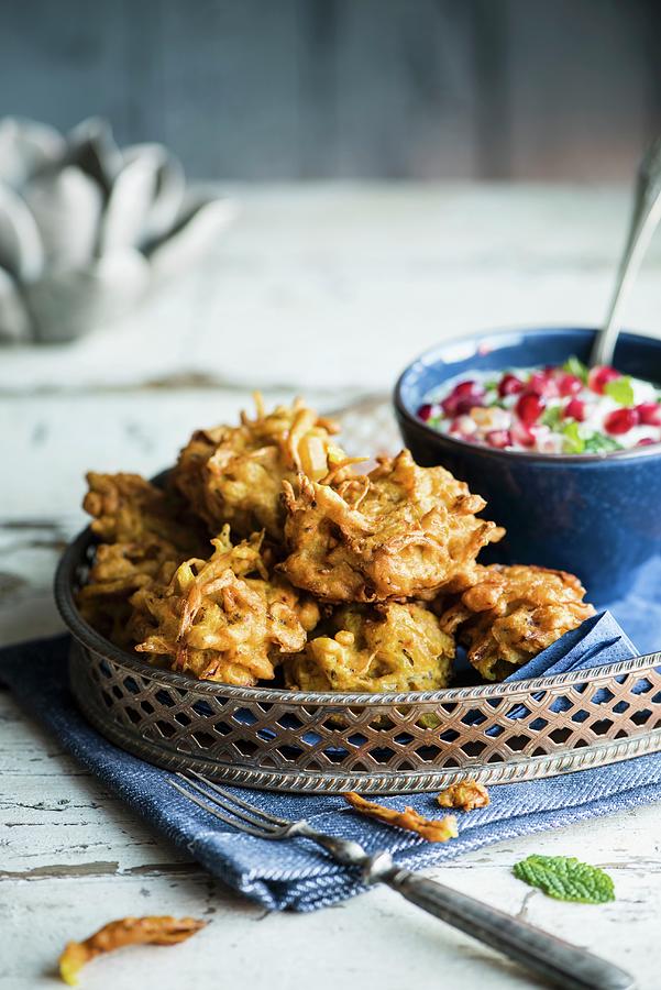 Onion Bhajis deep Fried Onions In Batter, India With Raita Photograph