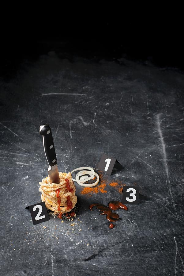 Onion Rings, A Knife, And Ketchup Arranged In The Style Of A Crime Scene Photograph by Manuela Rther