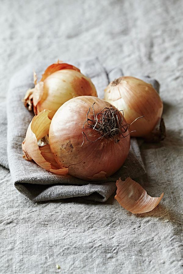 Onions On A Linen Cloth Photograph by B.&.e.dudzinski